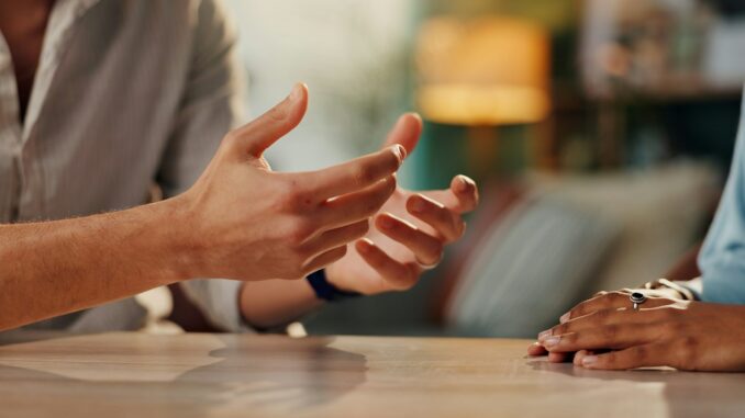 Couple, hands and dispute with anxiety, stress and drama at home or apartment. Frustrated, woman an